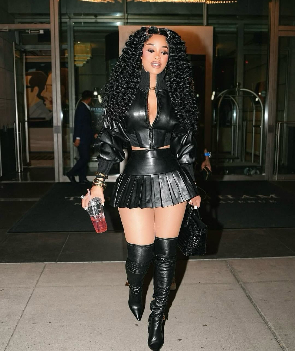 Keyshia KaOir Stepped Out With Gucci Mane In A Black Norma Kamali Leather Jacket And Pleated Mini Skirt