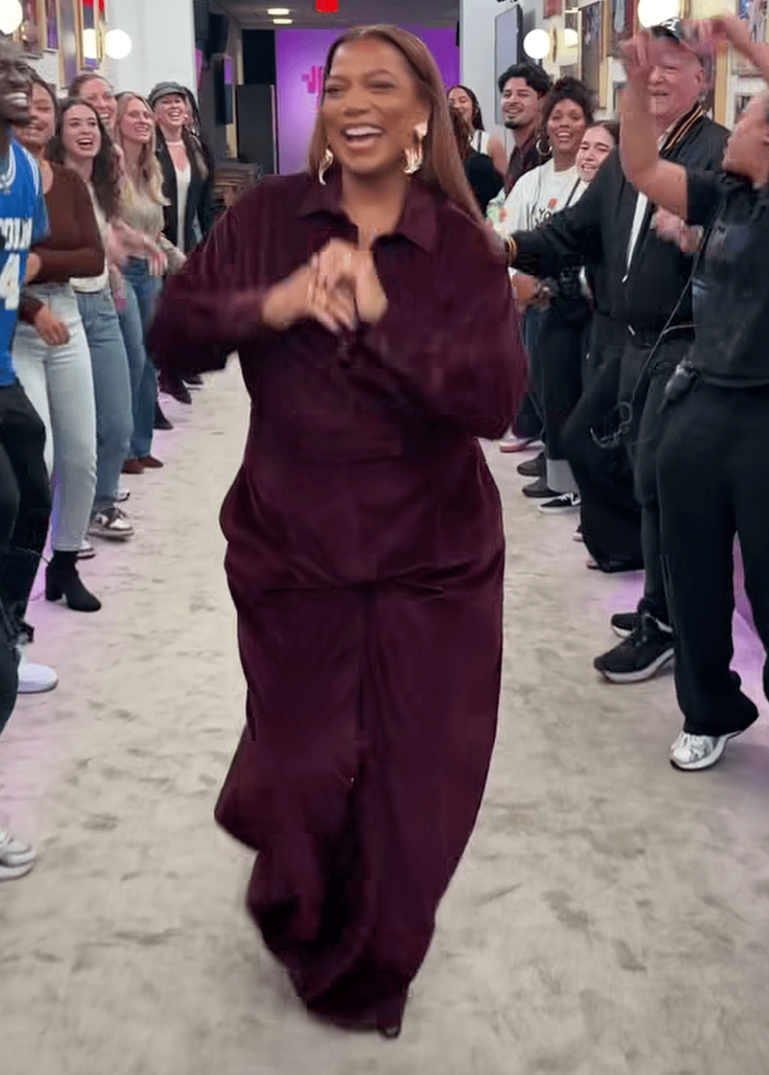Queen Latifah Wears A Burgundy Velvet Jumpsuit By Max Mara On The Jennifer Hudson Show