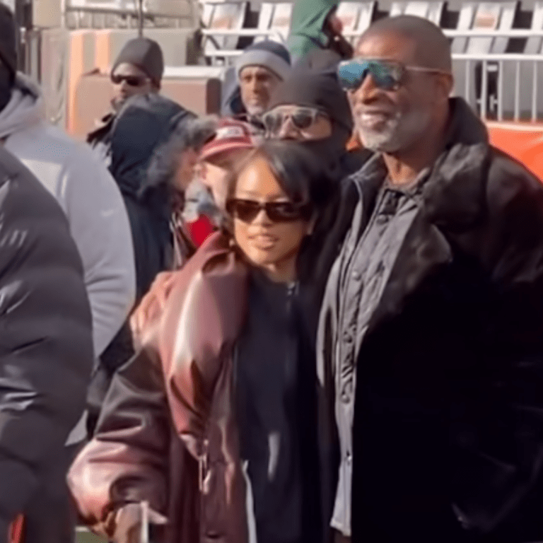 Karrueche Tran and Deion Sanders Support Shedeur Sanders, with Karrueche in a Brown Puffy Leather Rowen Rose Coat
