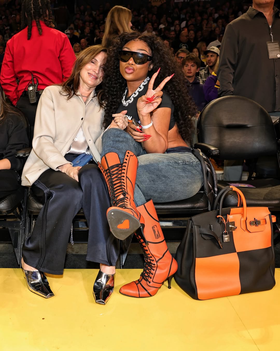 2 Megan Thee Stallion Courtside In Orange Lace Up Heels And A Black And Feu Hermes Casaque HAC Bag At The Mavs Vs Lakers Game