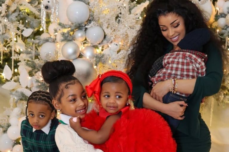 Cardi B Celebrates Christmas with Her Children in an Olive Green Bodycon Dress with Silver Metallic Heels