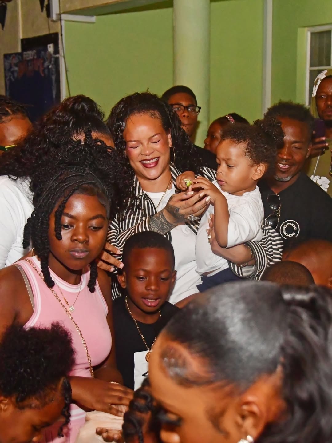 09 Rihanna Poses With Her Aunt Grandmother And Sons In Barbados Wearing A 3900 Bottega Veneta Jacket And 1350 Miu Miu Sneakers