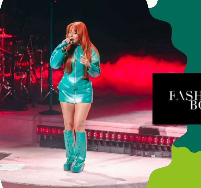 Mariah The Scientist Performed in DC in a Teal Green $1,478 KNWLS ‘Neo’ Coat and Custom Laura Andraschko Riding Boots