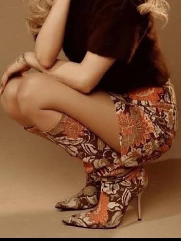 2 Yung Miami In Brown Dolce Gabbana Floral Mini Skirt And Matching Boots With Gold Corset Top In New York