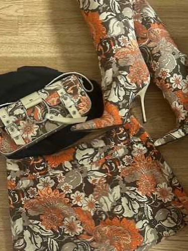 4 Yung Miami In Brown Dolce Gabbana Floral Mini Skirt And Matching Boots With Gold Corset Top In New York