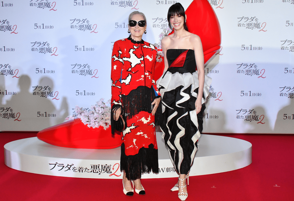 99 The Devil Wears Prada 2 Tokyo Fan Event Anne Hathaway In Black And Ivory Valentino Couture Silk Gown And Meryl Streep In Red And Black Chanel Metiers DArt Fringe Tweed Set