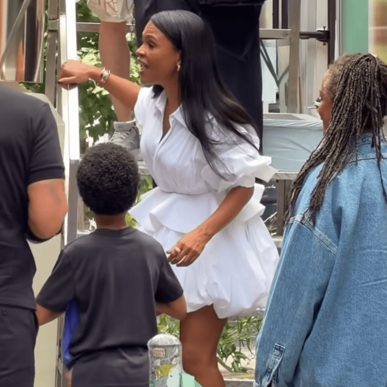 Nia Long Wore a Celine White Sculptural Shirt Dress and The Attico Ornella Dark Green Platform Stiletto Sandals at the Estée Lauder Pop-Up Bus in New York City