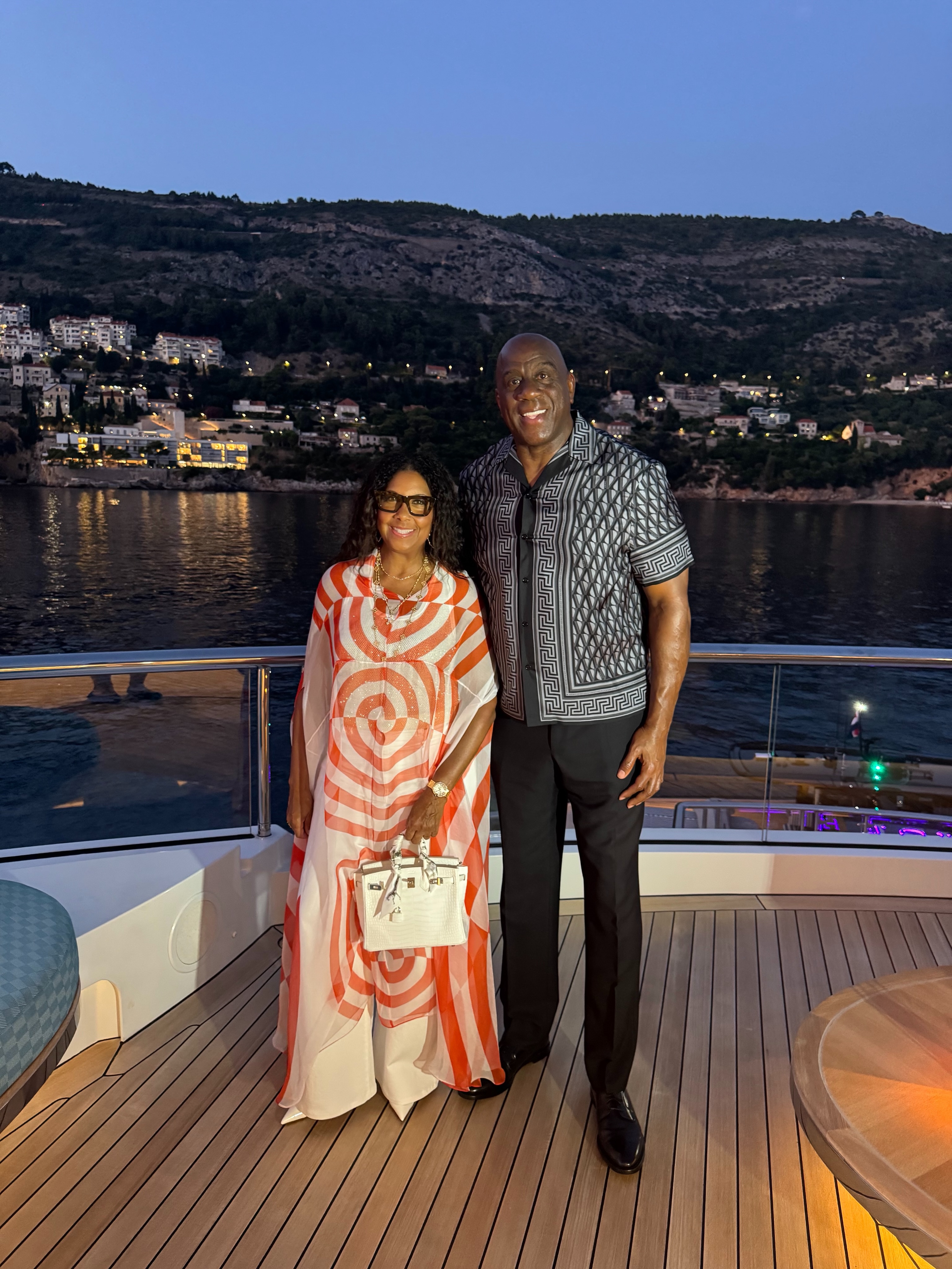Magic Johnson Cookie Johnson In Dries Van Noten And EJ Johnson In Gucci Snake Shorts Set Enjoy Family Dinner In Croatia